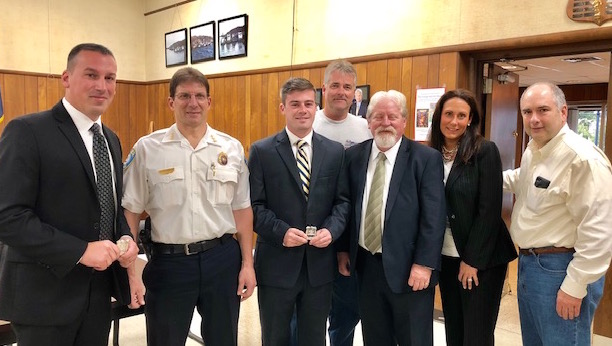 Two new Northport Police Officers, Douglas Pyne and Patrick O’Brien, after they were sworn in and presented with their badges at Village Hall on October 11, 2108. They will attend the Suffolk County Police Academy starting on October 15, 2018 and graduate in May of 2018. L to R: PO Douglas Pine, Chief Bill Ricca, PO Patrick O’Brien, Trustee Ian Milligan, Mayor Damon McMullen, Trustee Mercy Smith and Trustee/Police Commissioner Jerry Maline.