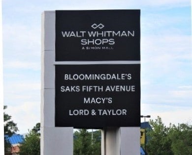 Walt Whitman Shops sign
